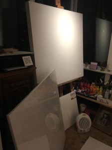 Easel, canvases, heater and supplies