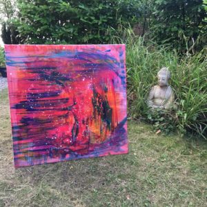 Buddha in the garden with a freshly made painting